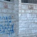 Cancellate le scritte sotto Palazzo Vescovile